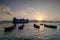 Fisherman traditional boat and ferry during sunset.