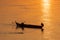 Fisherman on the traditional boat  on the Mekong River in Cambodia