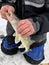 Fisherman unhooking a Walleye ice fishing