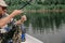 Fisherman unravels knots on fishing line
