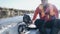 A fisherman uses an echo sounder while fishing while on a boat.