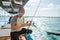 fisherman using a smartphone to send messages while fishing