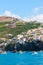 Fisherman village Camara de Lobos in Madeira Island, Portugal photographed from the waters of the Atlantic ocean. City on a