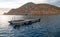 Fishermans early dawn sunrise view of bait supply boat at Lands End in Cabo San Lucas in Baja California Mexico