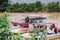 Fishermans resting at their boats on the river near Pantai Batu Buruk