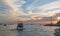 Fishermans sunrise view of fishing boats going out for the day past Lands End in Cabo San Lucas in Baja California Mexico