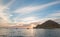 Fishermans sunrise view of fishing boats going out for the day past Lands End in Cabo San Lucas in Baja California Mexico