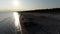 Fishermanâ€™s boat at the beach, silhouette aerial view.