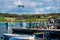 Fishermen back from sea, sorting out their catch and nets on a quay at Marsaxlokk fishing village