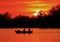 Fishermen boating on a pond