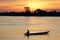 Fishermen on boats with sunrise