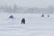 Fishermen catch fish on the ice in winter