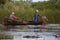 Fishermen checking nets at dawn in Danube Delta