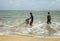 Fishermen cleaning nets