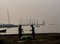 Fishermen cleaning nets on a port background