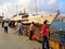 Fishermen and ferry at harbour front