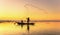 Fishermen fishing in the early morning golden light