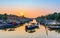 Fishermen going out to the sea by boat during sunset