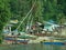 Fishermen houses and fishing boats and pirogues in Pulau Pangkor, Malaysia