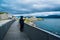 Fishermen on Hulvagen Bridge near Atlantic Ocean Road, passing through small islands in Norwegian Sea, Norway