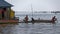 Fishermen in longboat, Tonle Sap, Cambodia