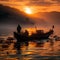 Fishermen looking for fish in the sea with a silhouette background in the afternoon