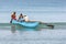 Fishermen paddle an outrigger canoe at Uppuveli in Sri Lanka.