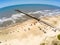 Fishermen pier, sand and waves