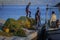 Fishermen on pier of town of Fiscardo on island of Kefalonia i