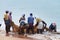 Fishermen pull their fishing net on Samudra beach in Kovalam