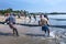 Fishermen pull in their fishing nets on the beach at Uppuveli in Sri Lanka.