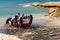 Fishermen pulling a boat ashore