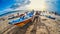 Fishermen pushing fishing boat together at Jimbaran Bali