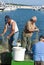 Fishermen repairing fishing nets