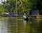 A fishermen rowing a boat for his daily work in the backwaters of alleppey in Kerala