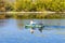 Fishermen rowing on an inflatable boat to catch predatory fish