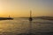 Fishermen and sailboat at sunset in Alimos marina in Athens, Greece