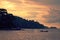 Fishermen sailing at sunset off the coast of Phuket, Thailand.