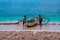 fishermen on the shore, with her partner, at the paal beach, likupang sulawesi utara indonesia.