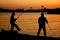 Fishermen silhouette on the beach