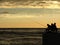 Fishermen silhouettes at the sunrise on the dock