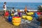 Fishermen sort caught fish on the Indian ocean shore