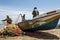 Fishermen sort fish from their nets on the beach at Negombo in Sri Lanka.