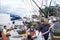 Fishermen sorting out the catch on a boat deck