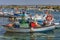 Fishermen on their boat in Fuseta Harbour, Algarve, Portugal.