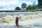 Fishermen, throw a net,Fishermen throw a net on the rubber dam .