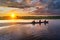 Fishermen in a traditional boat called peke peke in the Amazon jungle in Peru in the morning, a beautiful sunrise, go fishing