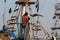 Fishermen are waiting for the end of unloading on the deck of the ship.