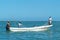 FIshermen withdrawing the fishing net from their boat at Holbox