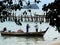 Fishermen at work on a small pirogue in the island of Langkawi, Malaysia